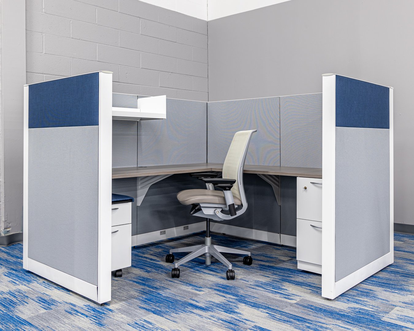 A full view of the refurbished Steelcase Answer Blue/Gray cubicle with blue accent panels and gray finishes.