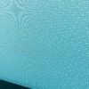 Detailed view of the teal fabric panels used in the Haworth 3-Pack Cubicle, adding a modern and vibrant touch.